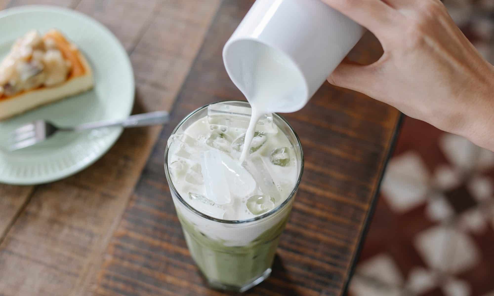 Photo by Charlotte May: https://www.pexels.com/photo/crop-unrecognizable-woman-adding-milk-to-iced-matcha-tea-5946965/